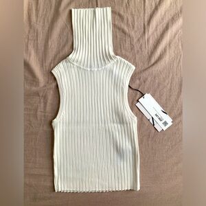 AVAILABLE IN JUNE Zara high neck sleeves less knit top in crème